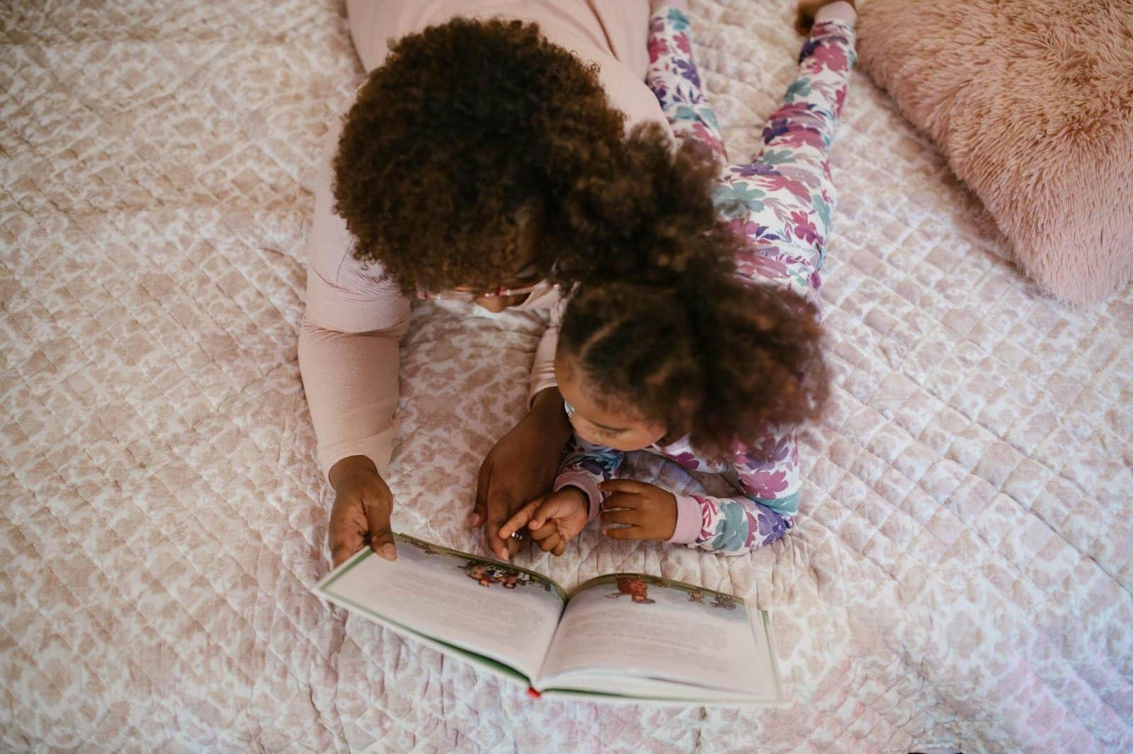 pexels-photo-10566125 - CurioBuddy An image of mother and daughter reading book together. CurioBuddy encourages parents to create special bonds through reading its digital magazines and ignite curiosity.