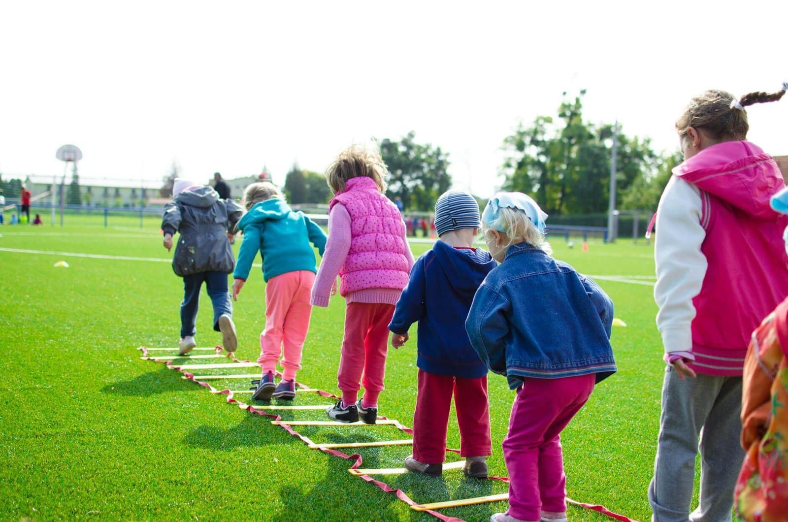 Hello CurioBuddy featured Image - CurioBuddy children's team engaged in collaborative and joyful learning and building on green grassland. With CurioBuddy learning is a joyful journey for kids, not a chore.