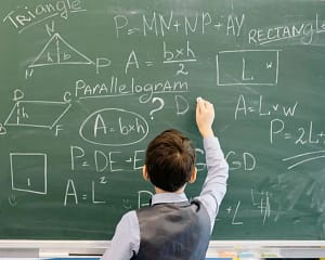 Critical thinking skills help in problem solving - CurioBuddy A student solving a problem on the chalkboard using his critical thinking skills. CurioBuddy offers resources like interactive games and kids magazines to develop these skills.
